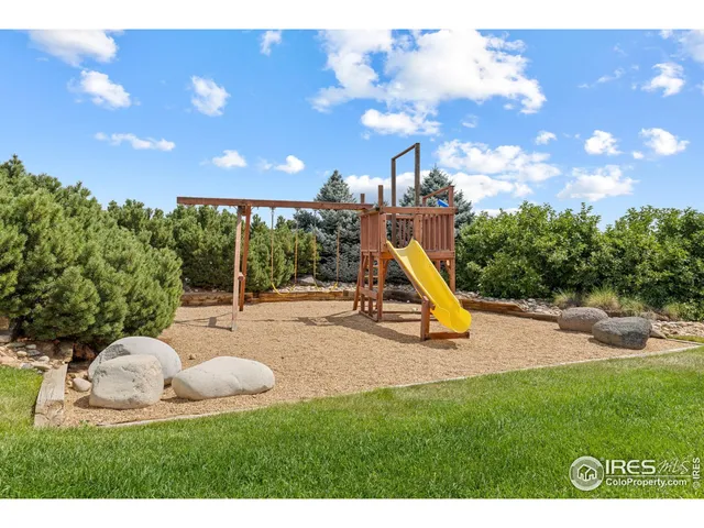 a view of a playground with a patio
