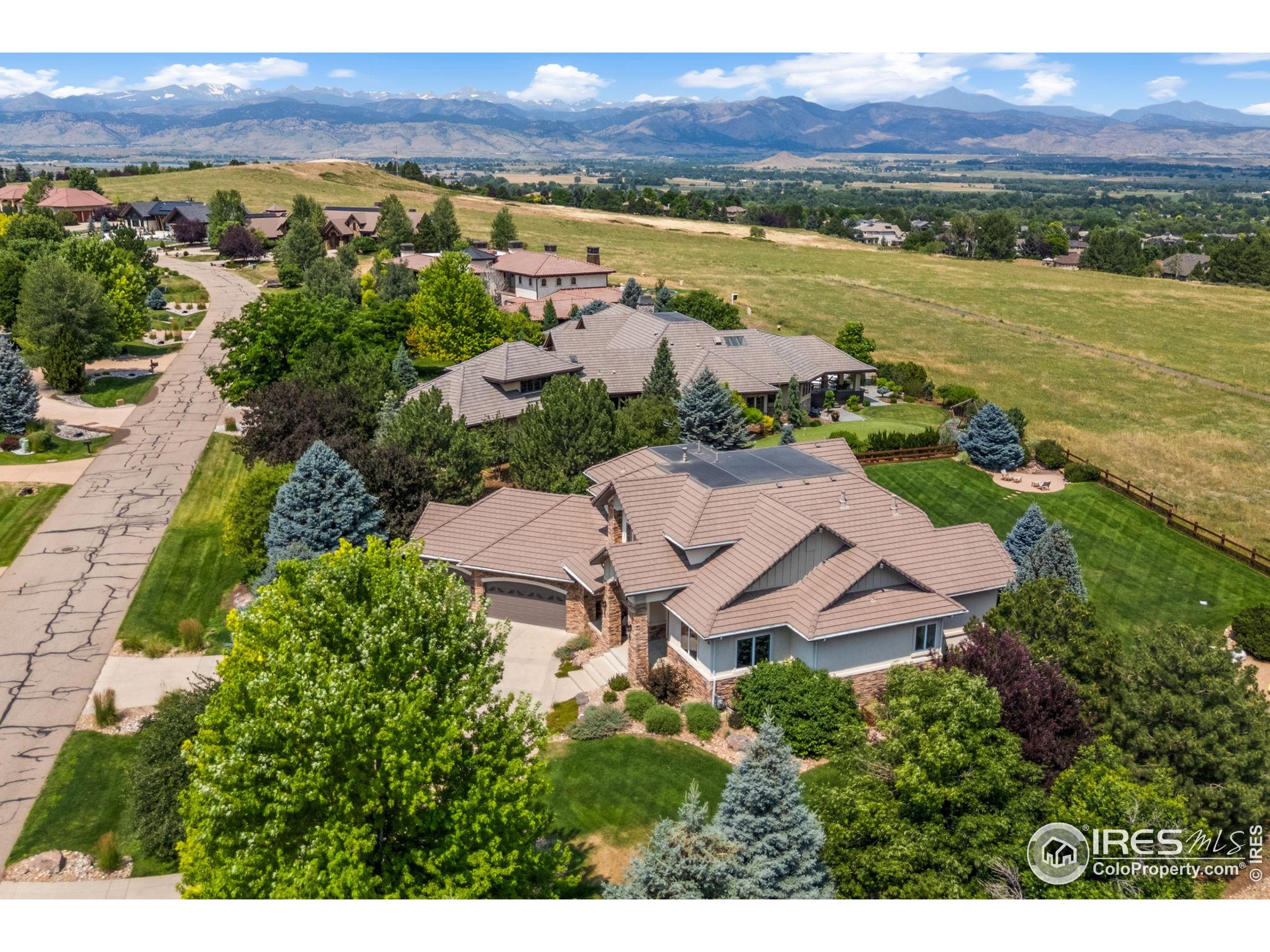 6557 Legend Ridge Trail Niwot, CO 80503 - Photo 3 of 42 an aerial view of residential houses with outdoor space and river