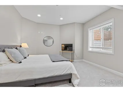 a bedroom with a bed and a table