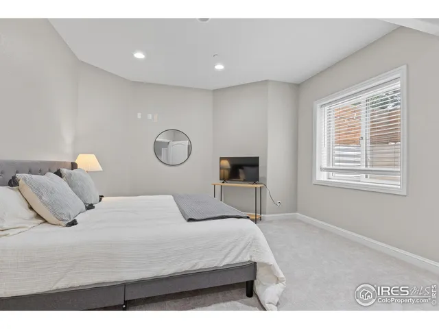 a bedroom with a bed and a table