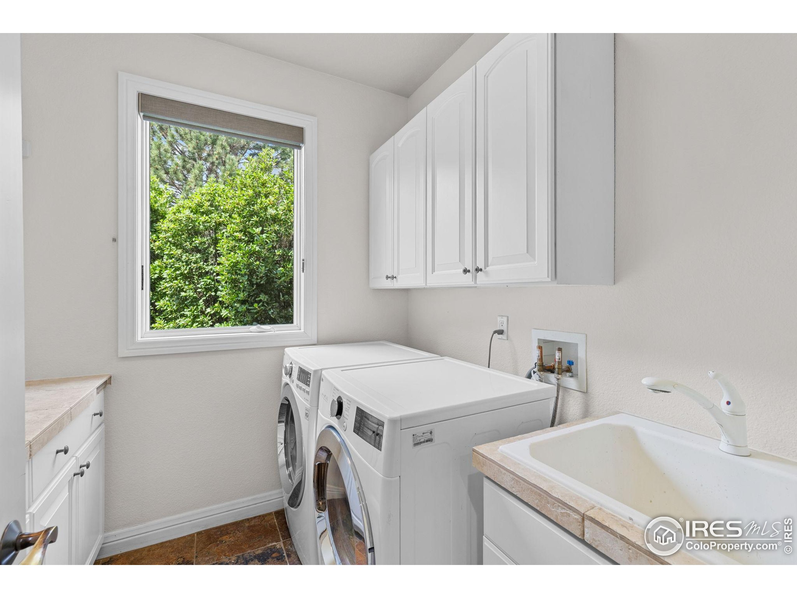 6557 Legend Ridge Trail Niwot, CO 80503 - Photo 39 of 42 a utility room with dryer and washer