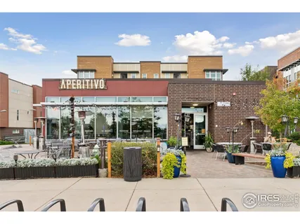 a view of a building with sitting area