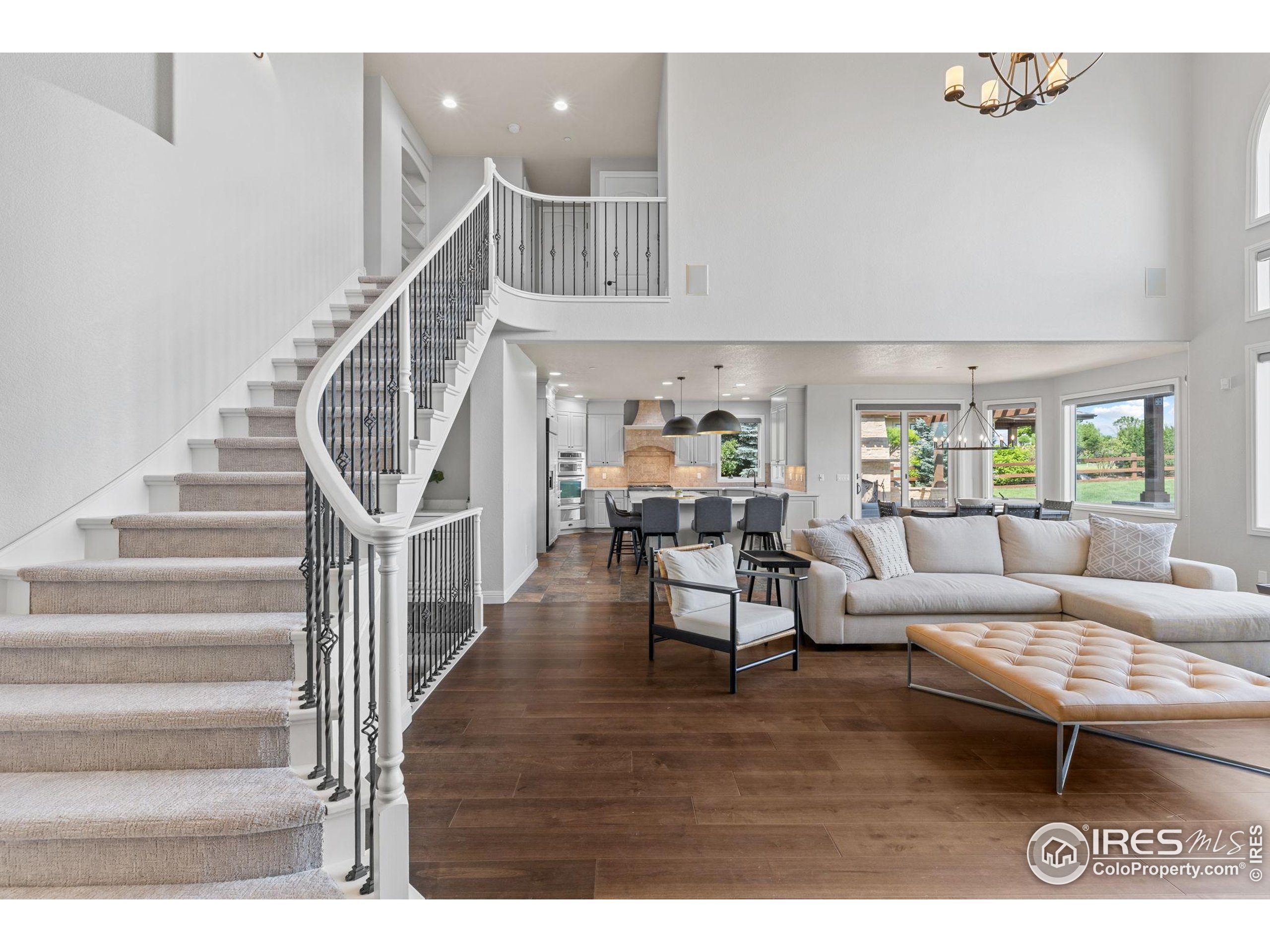 6557 Legend Ridge Trail Niwot, CO 80503 - Photo 8 of 42 a living room with furniture and a wooden floor