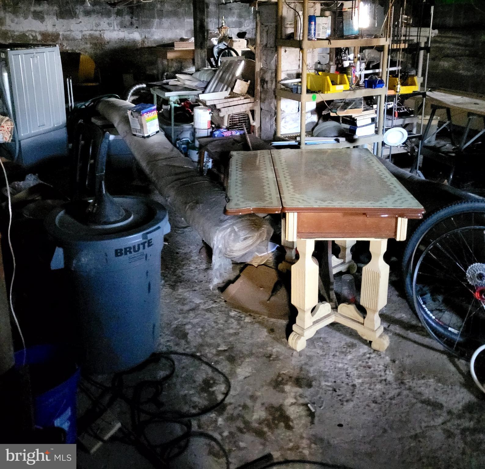 811 Washington Avenue Croydon, PA 19021 - Photo 8 of 35 a storage room with lots of clutter and chairs