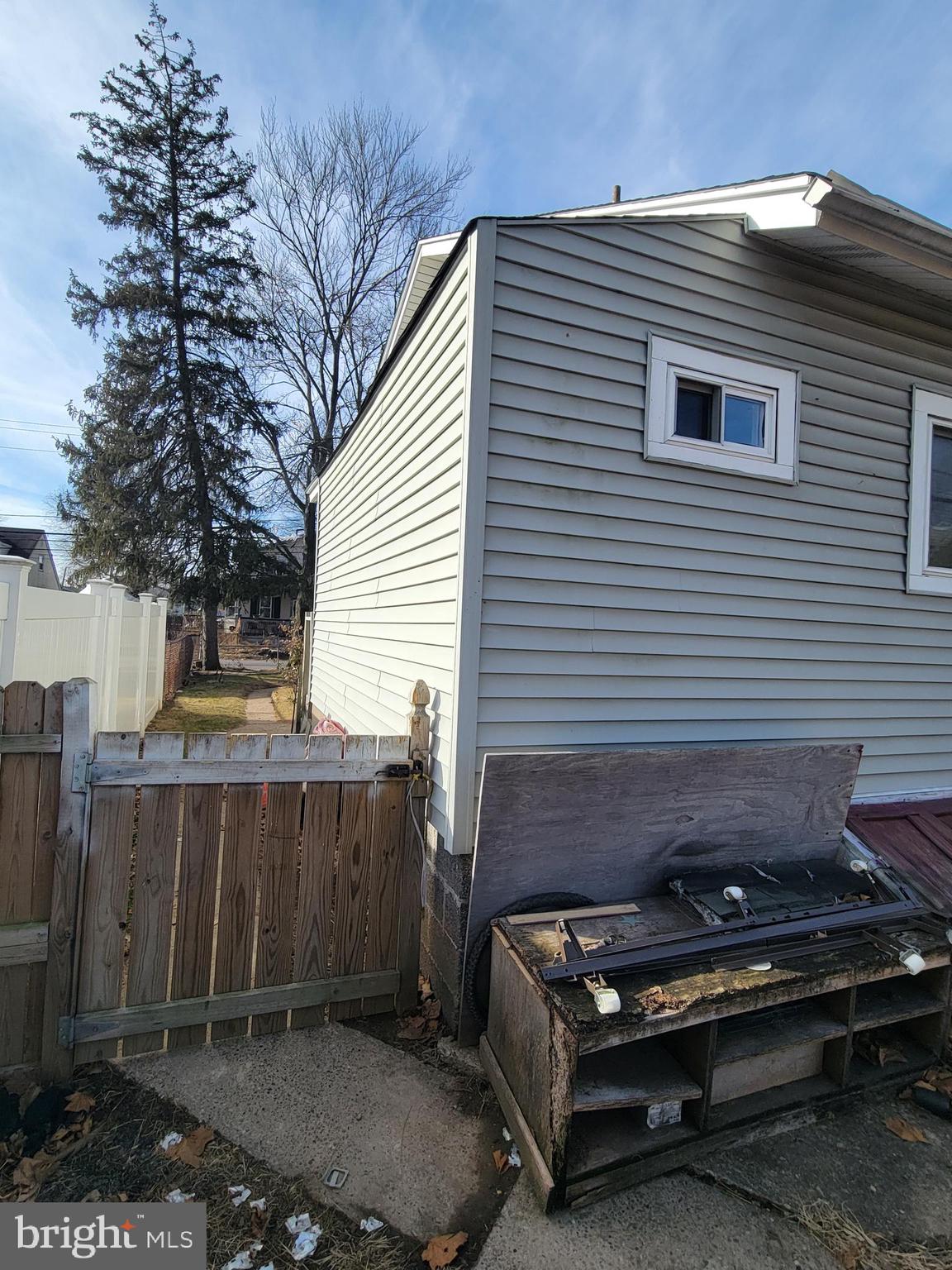 811 Washington Avenue Croydon, PA 19021 - Photo 9 of 35 a wooden bench sitting in front of a house