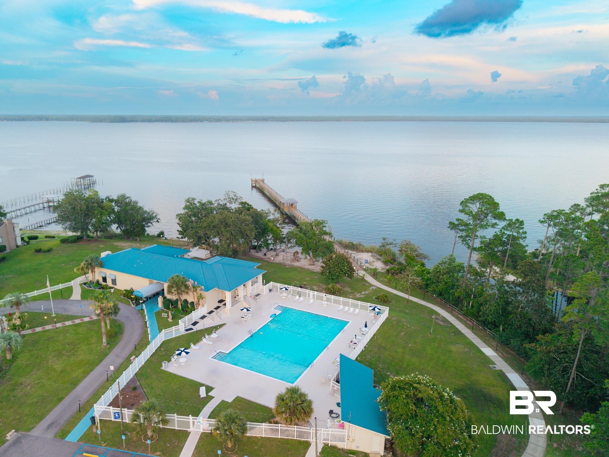 1563 Valencia Drive Lillian, AL 36549 - Photo 18 of 27 Aerial view of a pool area and a large body of water