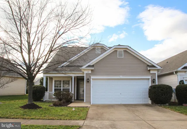 a view of a yard in front view of a house