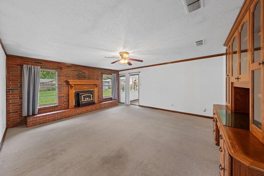 133 Oak Way Kerrville, TX 78028 - Photo 12 of 26 a view of a livingroom with furniture and a fireplace