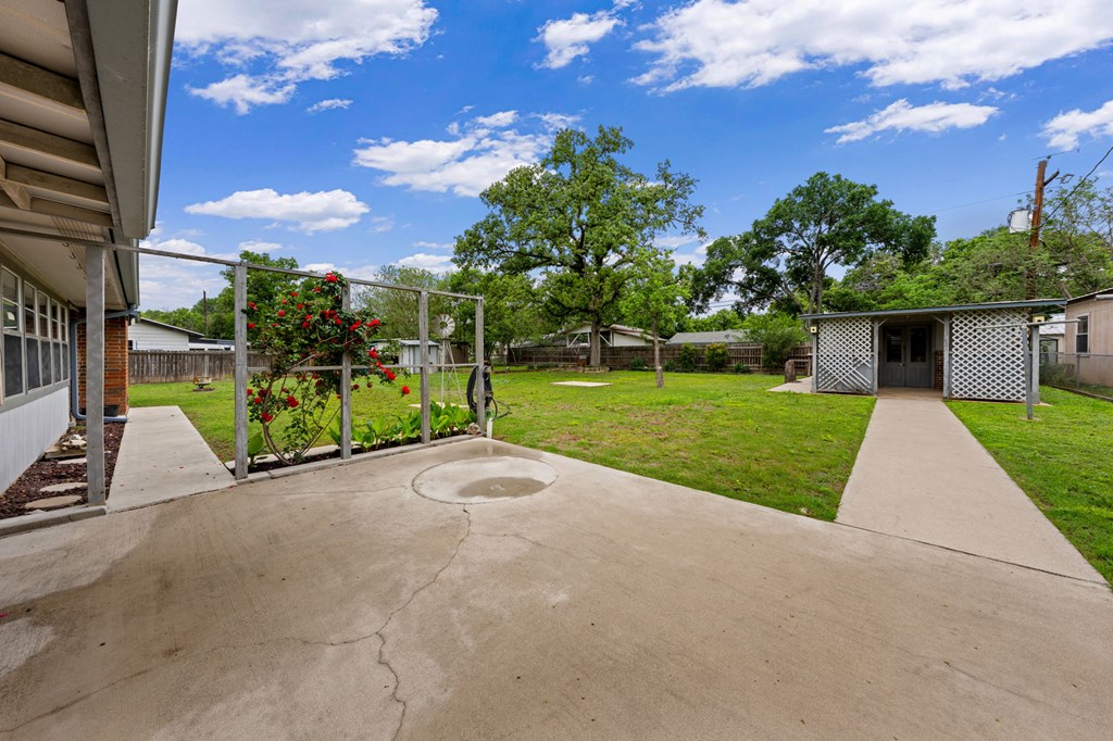 133 Oak Way Kerrville, TX 78028 - Photo 22 of 26 a view of a house with backyard and a patio