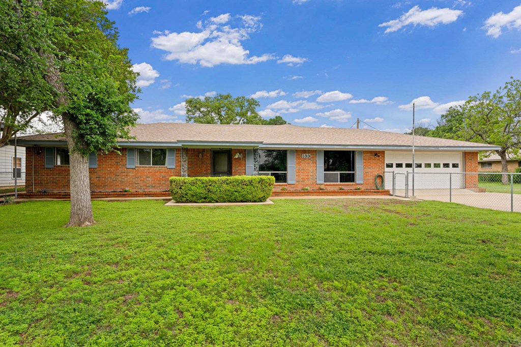 133 Oak Way Kerrville, TX 78028 - Photo 3 of 26 a front view of a house with a yard