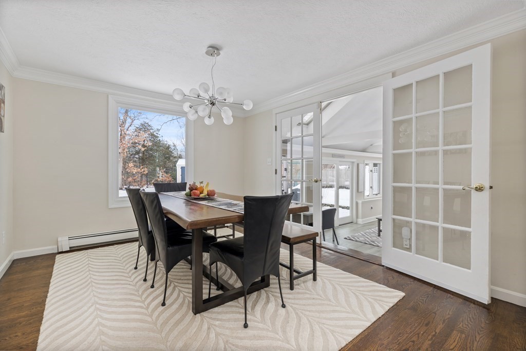 100 Manatee Road Hingham, MA 02043 - Photo 13 of 38 a view of a dining room with furniture and wooden floor