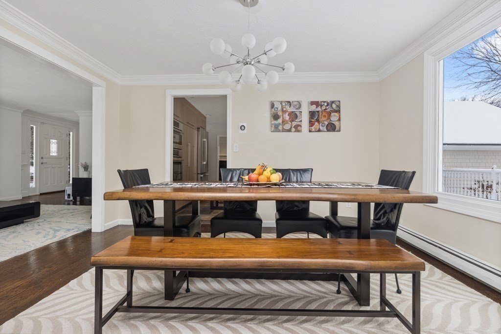 100 Manatee Road Hingham, MA 02043 - Photo 15 of 38 a view of a dining room with furniture window and wooden floor