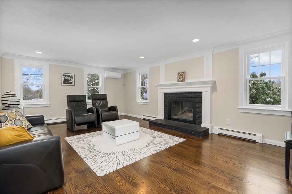 100 Manatee Road Hingham, MA 02043 - Photo 19 of 38 a living room with furniture and a fireplace