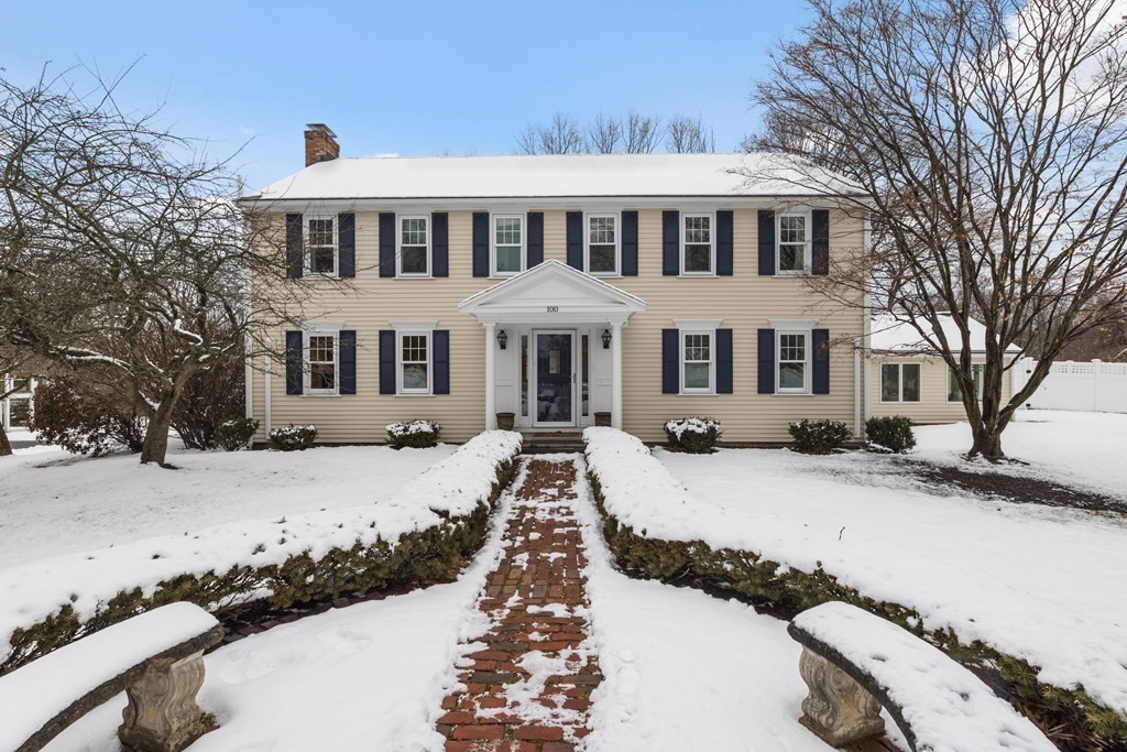 100 Manatee Road Hingham, MA 02043 - Photo 2 of 38 a front view of a house with a yard