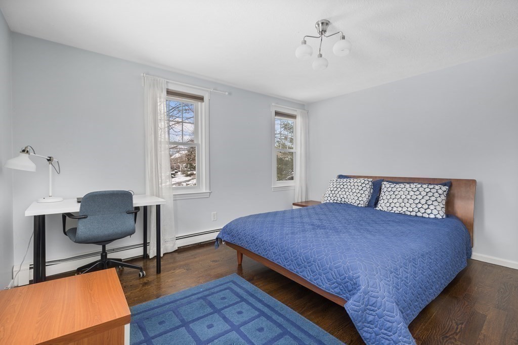 100 Manatee Road Hingham, MA 02043 - Photo 29 of 38 a bedroom with a bed and a chair