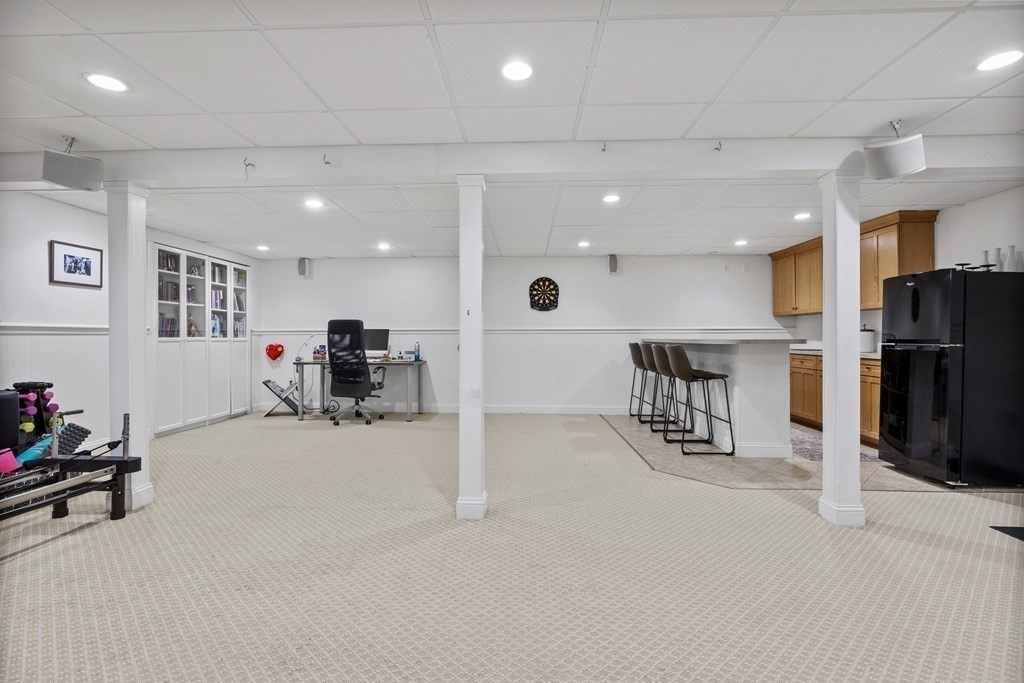 100 Manatee Road Hingham, MA 02043 - Photo 33 of 38 a view of a kitchen with furniture and a refrigerator