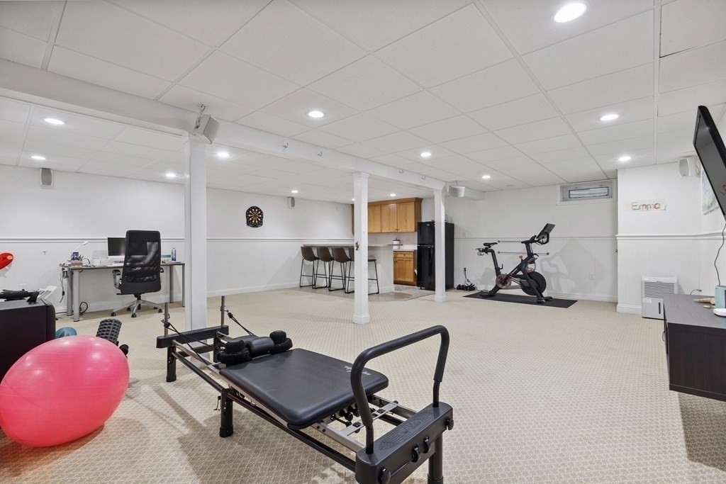 100 Manatee Road Hingham, MA 02043 - Photo 34 of 38 a room with gym equipment and kitchen view