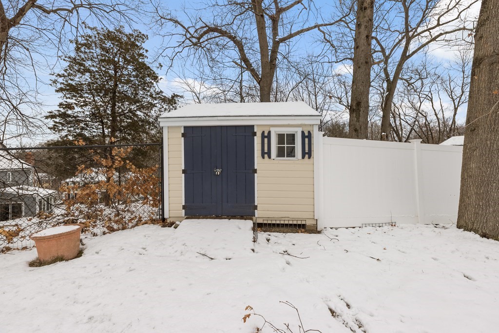 100 Manatee Road Hingham, MA 02043 - Photo 36 of 38 a view of a house with a snow in the yard