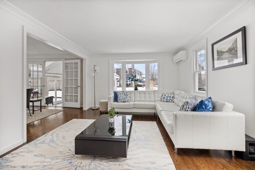 100 Manatee Road Hingham, MA 02043 - Photo 7 of 38 a living room with furniture and a large window