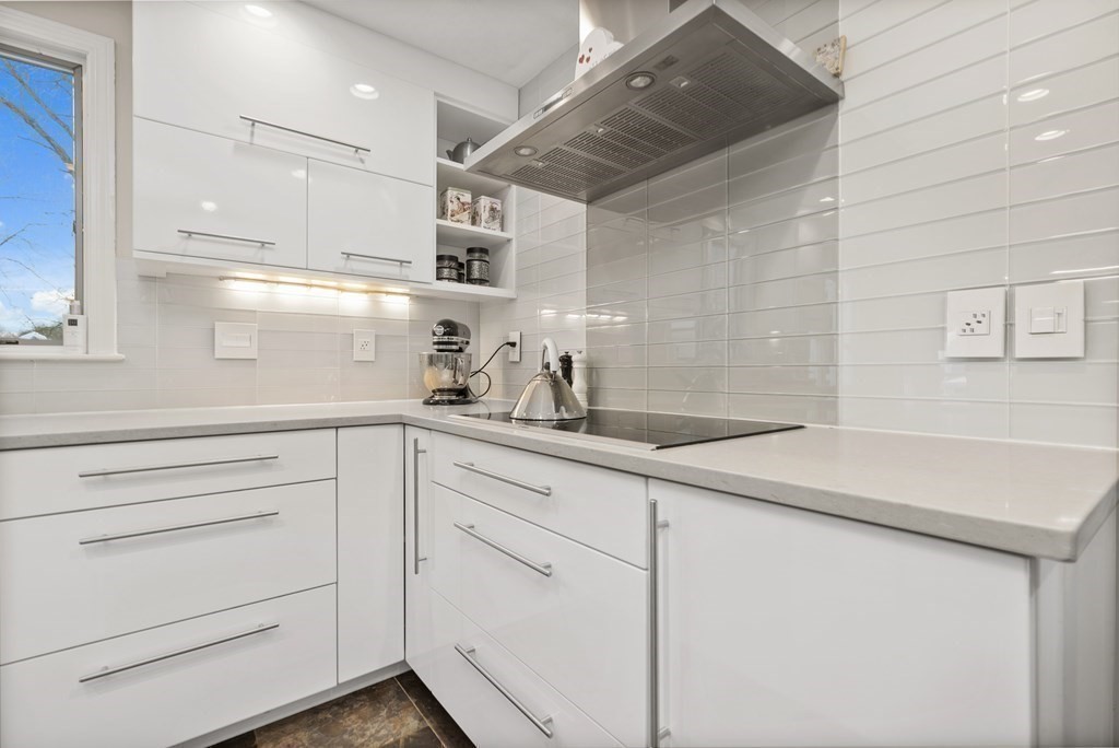 100 Manatee Road Hingham, MA 02043 - Photo 9 of 38 a kitchen with cabinets appliances a sink and a counter top space