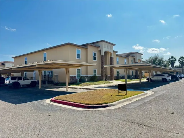 a swimming pool with outdoor seating and yard