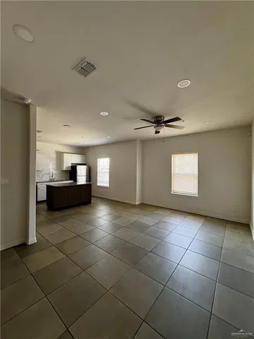 a view of a livingroom with a furniture and a ceiling fan
