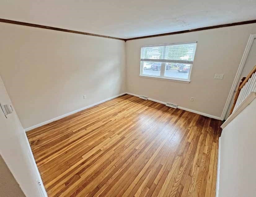 174 Pine Street Holbrook, MA 02343 - Photo 18 of 24 a view of a room with wooden floor and small window