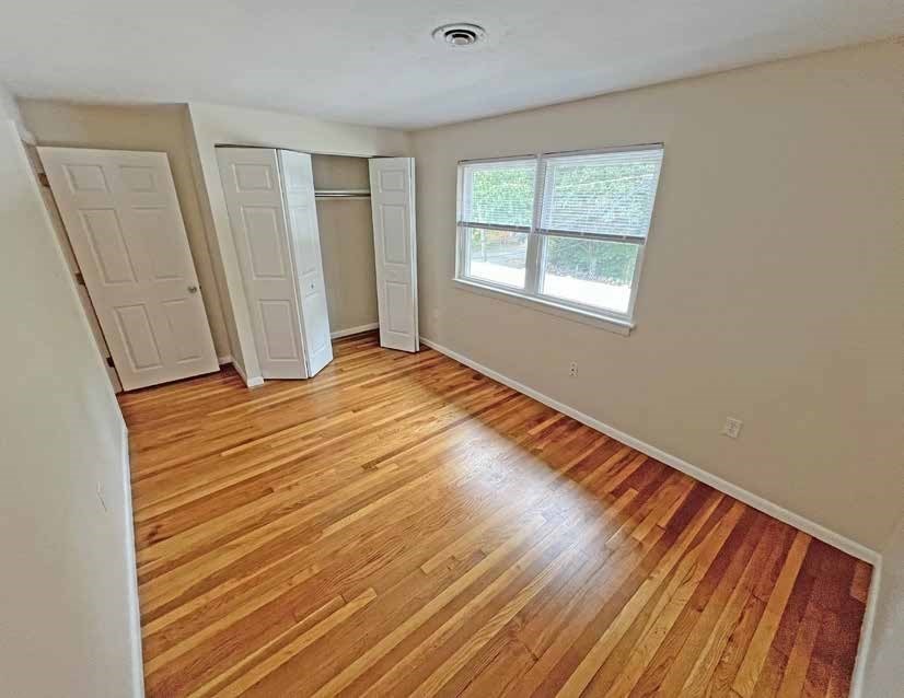 174 Pine Street Holbrook, MA 02343 - Photo 19 of 24 a view of an empty room with wooden floor and a window