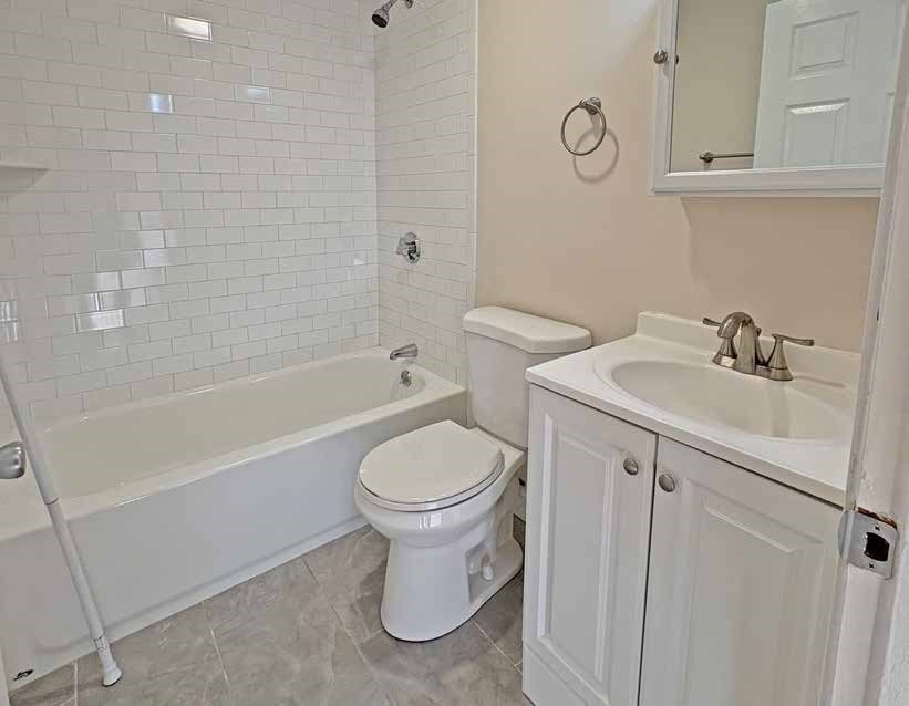 174 Pine Street Holbrook, MA 02343 - Photo 21 of 24 a bathroom with a sink toilet and shower