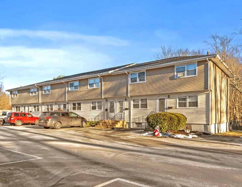 174 Pine Street Holbrook, MA 02343 - Photo 7 of 24 a front view of a building with cars