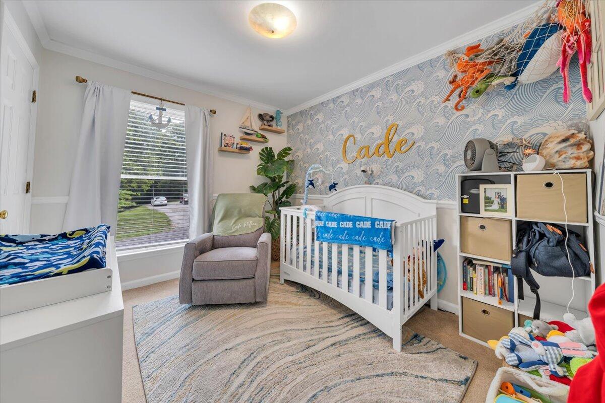 7851 Cedar Edge Road Roanoke, VA 24018 - Photo 20 of 44 a bedroom with baby crib and a window