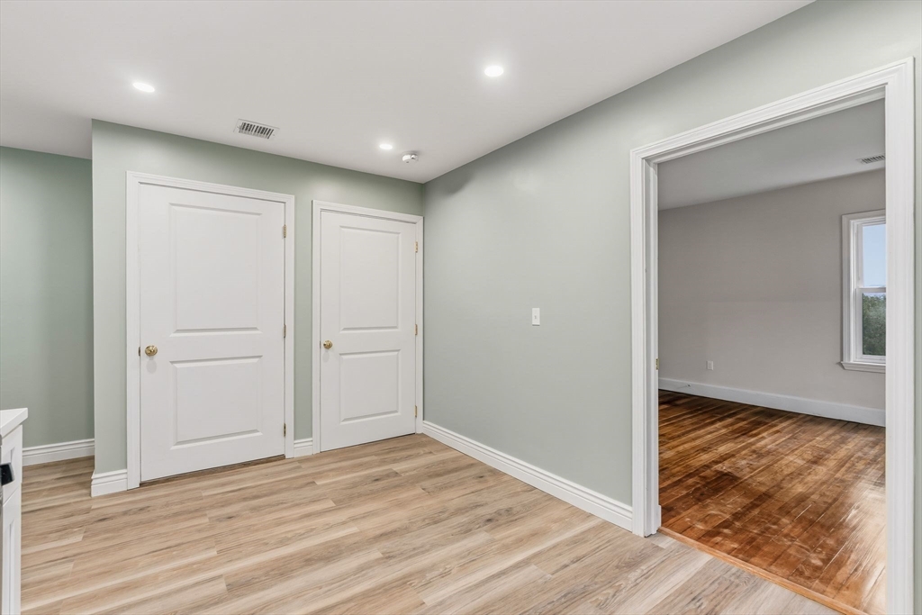 8 1/2 Intervale Street, Unit 10 1/2 Quincy, MA 02169 - Photo 5 of 16 a view of hallway with wooden floor
