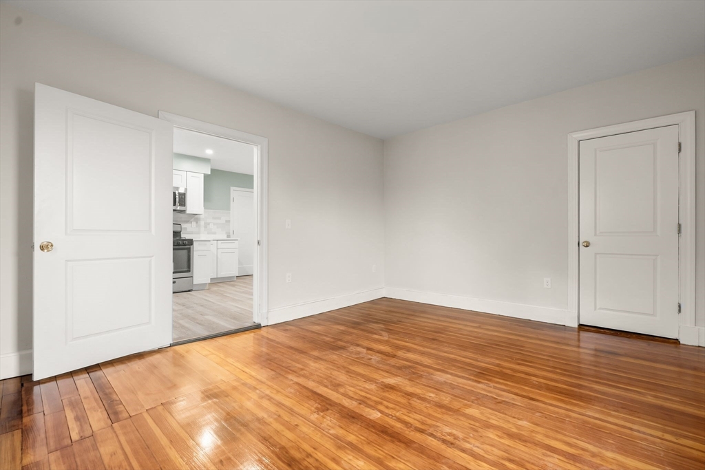 8 1/2 Intervale Street, Unit 10 1/2 Quincy, MA 02169 - Photo 7 of 16 a view of empty room with wooden floor
