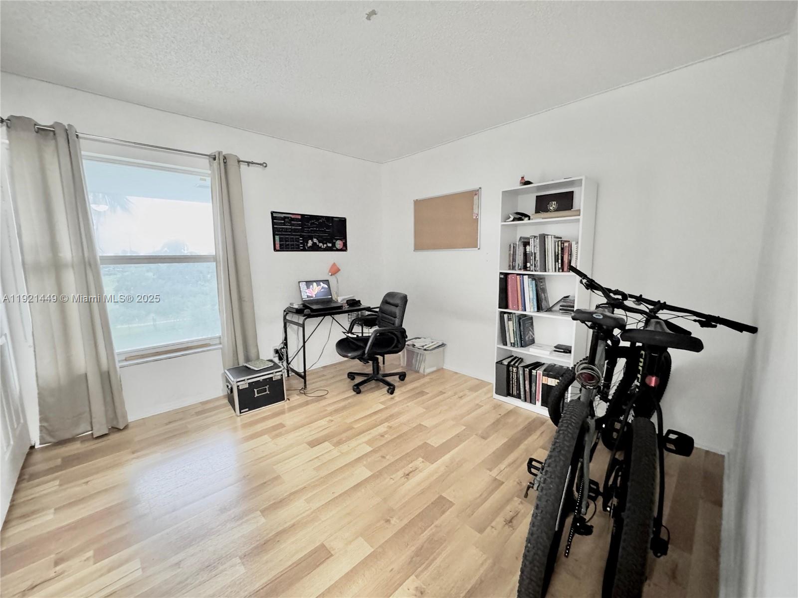 505 South Pine Island Road, Unit 407B Plantation, FL 33324 - Photo 10 of 23 a room with gym equipment and a window