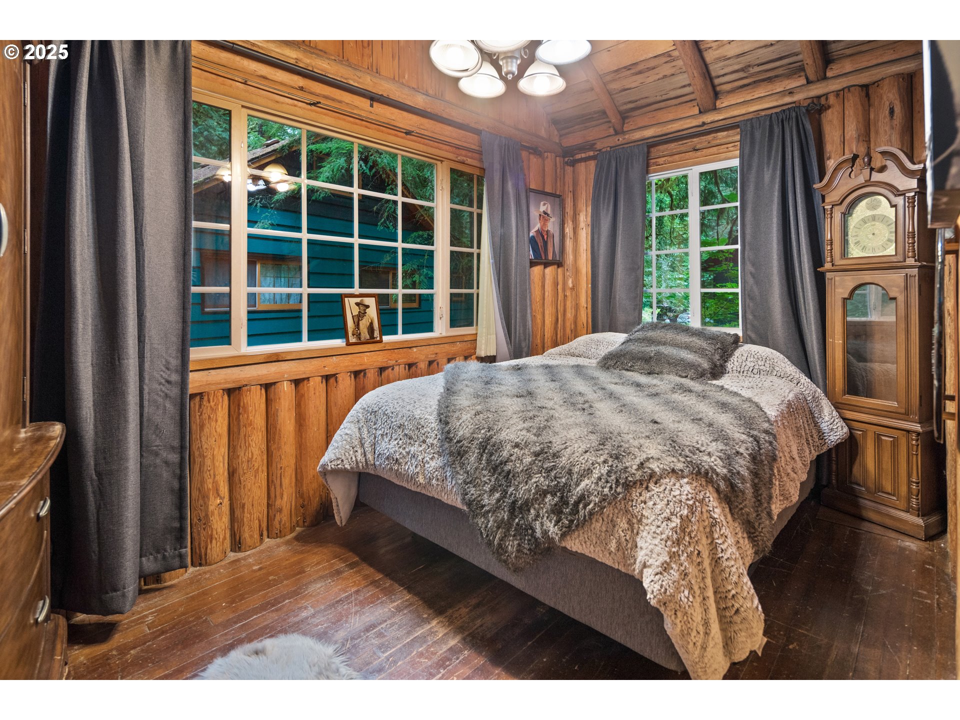 27172 East Marion Road Rhododendron, OR 97049 - Photo 14 of 48 a bedroom with a bed next to a window with outer view