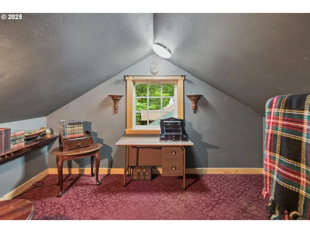 a room with furniture a rug and a window