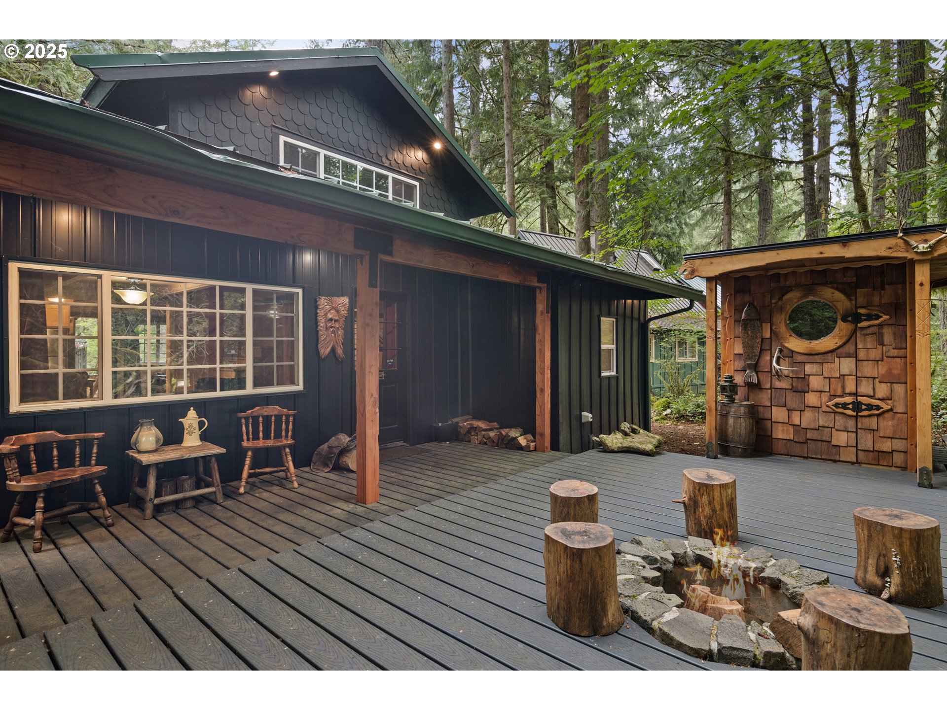 27172 East Marion Road Rhododendron, OR 97049 - Photo 34 of 48 a view of a patio with table and chairs and wooden floor
