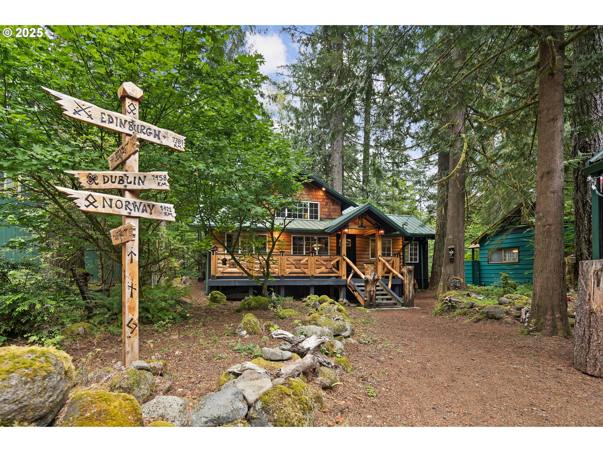 27172 East Marion Road Rhododendron, OR 97049 - Photo 45 of 48 a front view of a house with a yard
