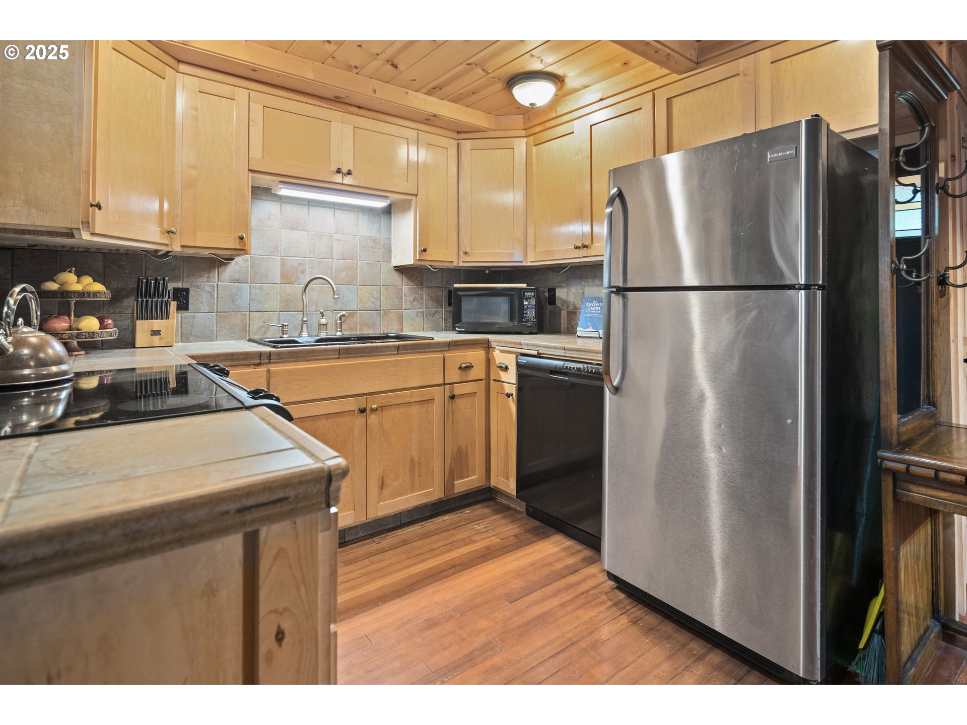 27172 East Marion Road Rhododendron, OR 97049 - Photo 7 of 48 a kitchen with a refrigerator and a sink