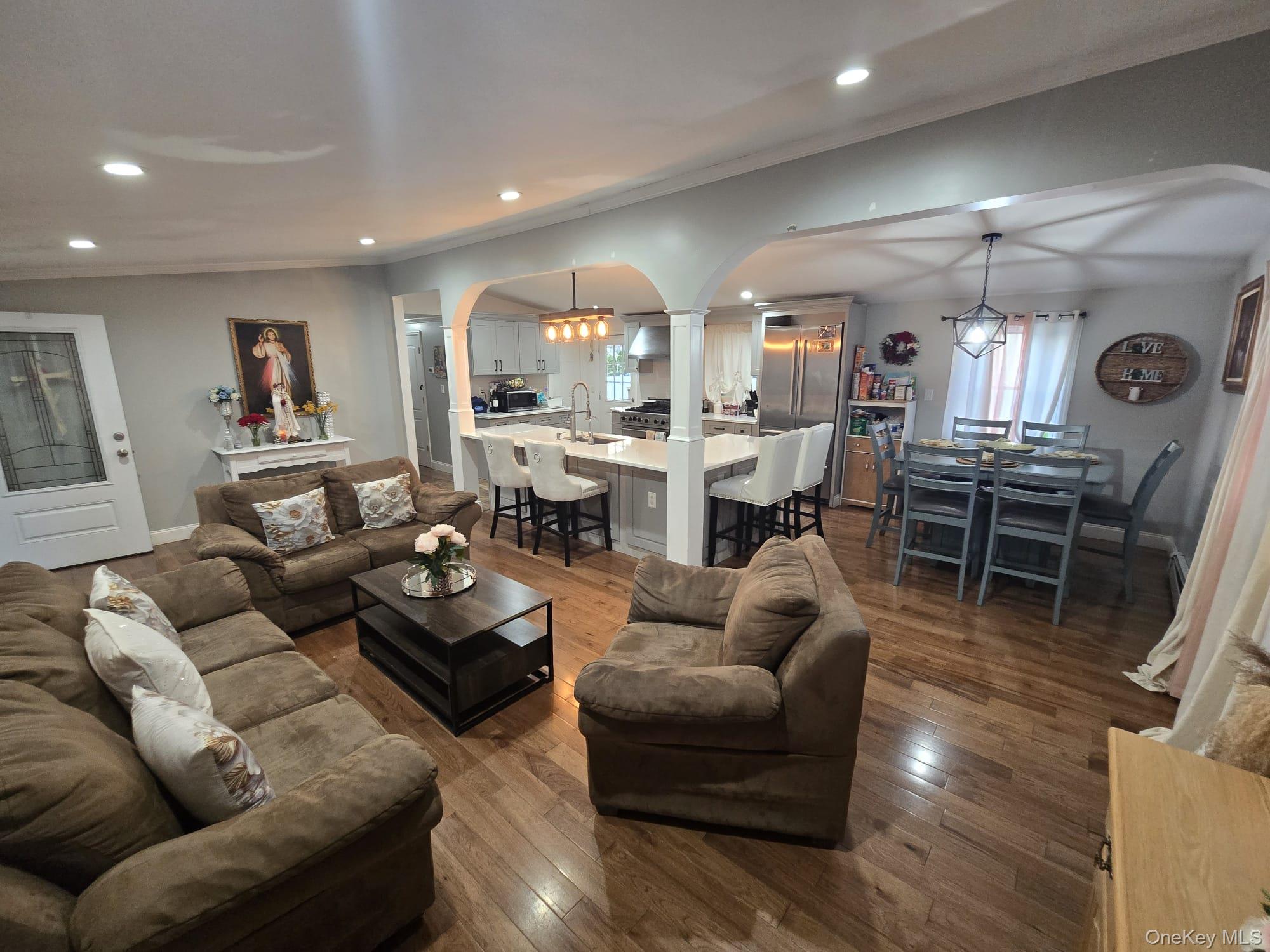 2 Ritter Avenue Amityville, NY 11701 - Photo 11 of 26 a living room with furniture kitchen view and a large window