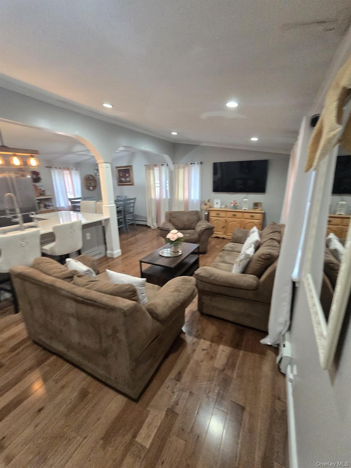 2 Ritter Avenue Amityville, NY 11701 - Photo 12 of 26 a living room with furniture and a flat screen tv