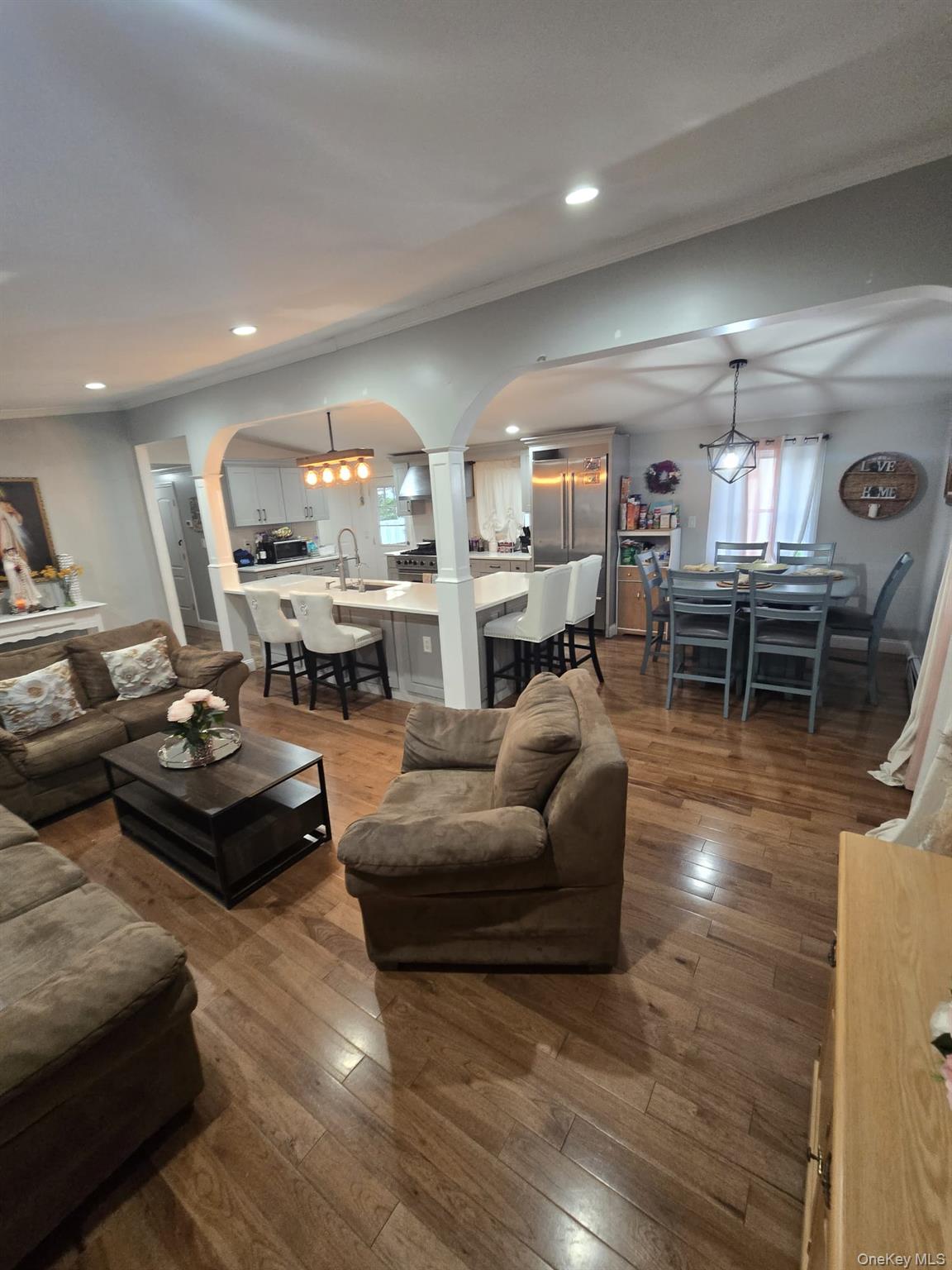 2 Ritter Avenue Amityville, NY 11701 - Photo 13 of 26 a living room with furniture kitchen view and a large window