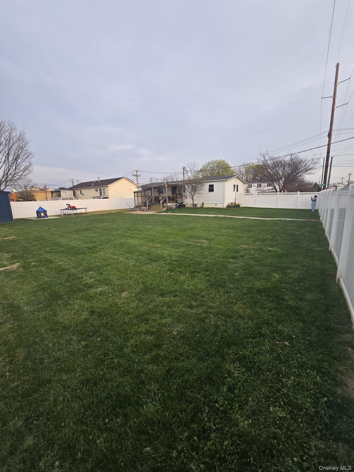 2 Ritter Avenue Amityville, NY 11701 - Photo 5 of 26 a view of a big yard with houses