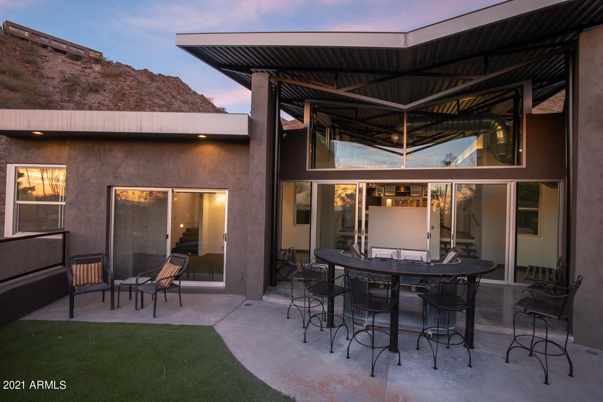 1902 East Mountain View Road Phoenix, AZ 85020 - Photo 21 of 26 a view of a dinning table and chairs in patio