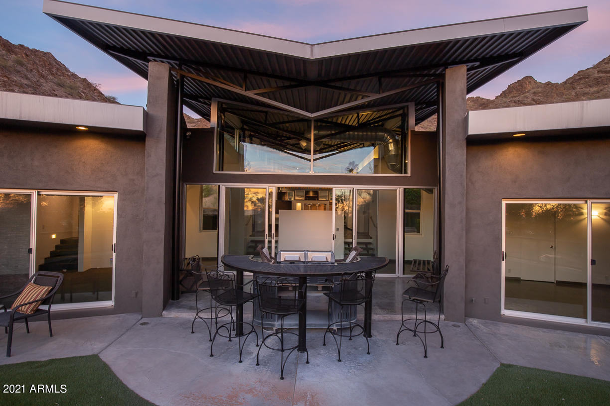 1902 East Mountain View Road Phoenix, AZ 85020 - Photo 22 of 26 a view of outdoor dining space with a table and chairs