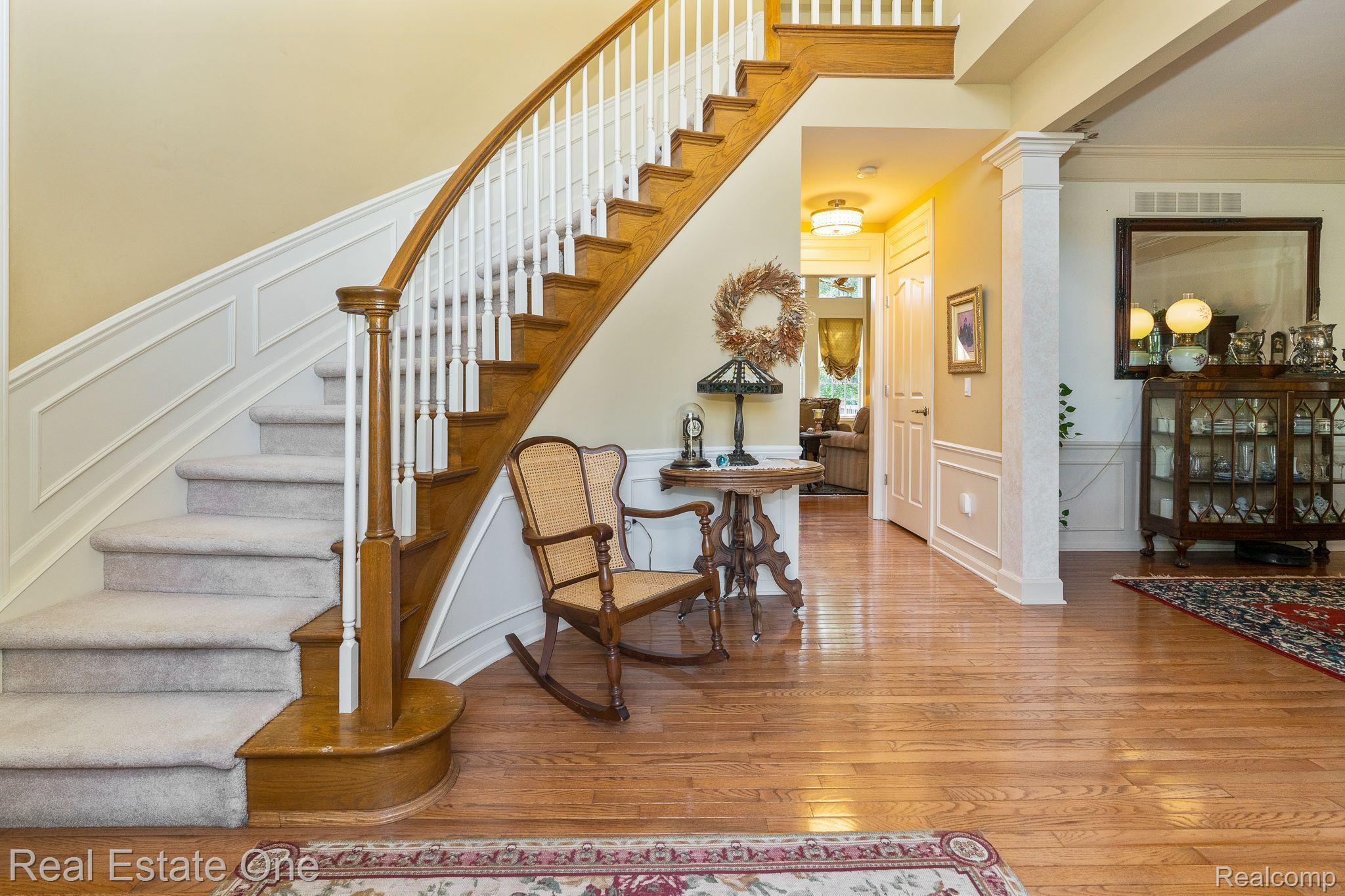 726 Loggers Circle Rochester, MI 48307 - Photo 3 of 64 Sweeping Staircase Meets You at the Front Door