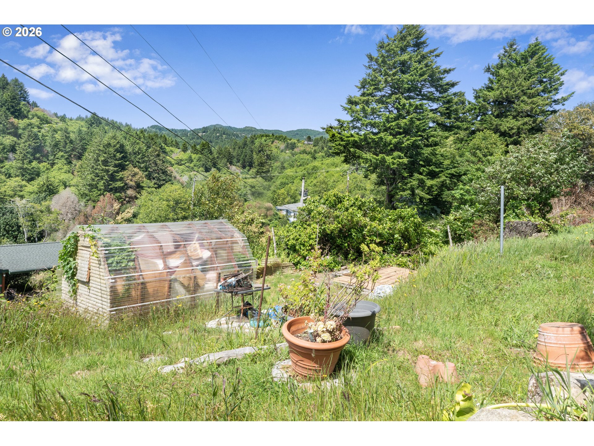 96465 Coverdell Road, Unit 8 Brookings, OR 97415 - Photo 14 of 16 a backyard of a house with a yard and outdoor seating