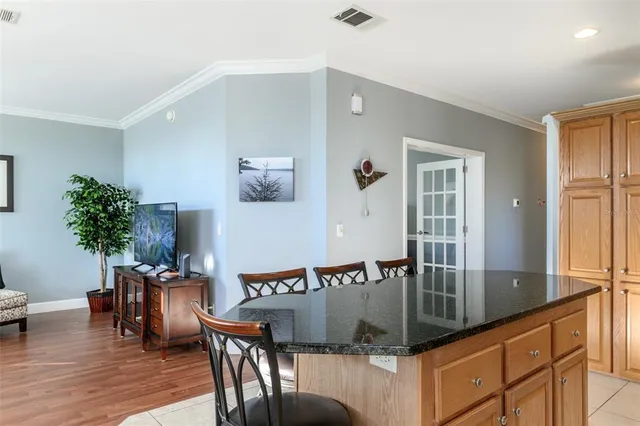 a living room with lots of furniture and a large window