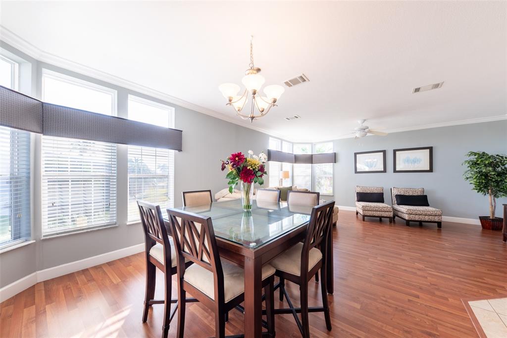2 Emden Circle Punta Gorda, FL 33950 - Photo 19 of 60 a view of a dining room with furniture wooden floor and chandelier