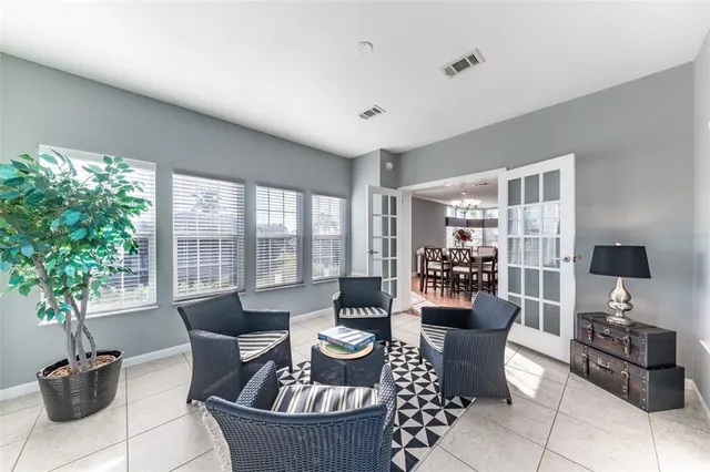 a living room with furniture and windows